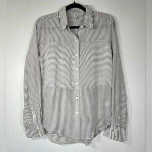 SPANX LOW MAINTENANCE 100% SILK BUTTON DOWN SHIRT.